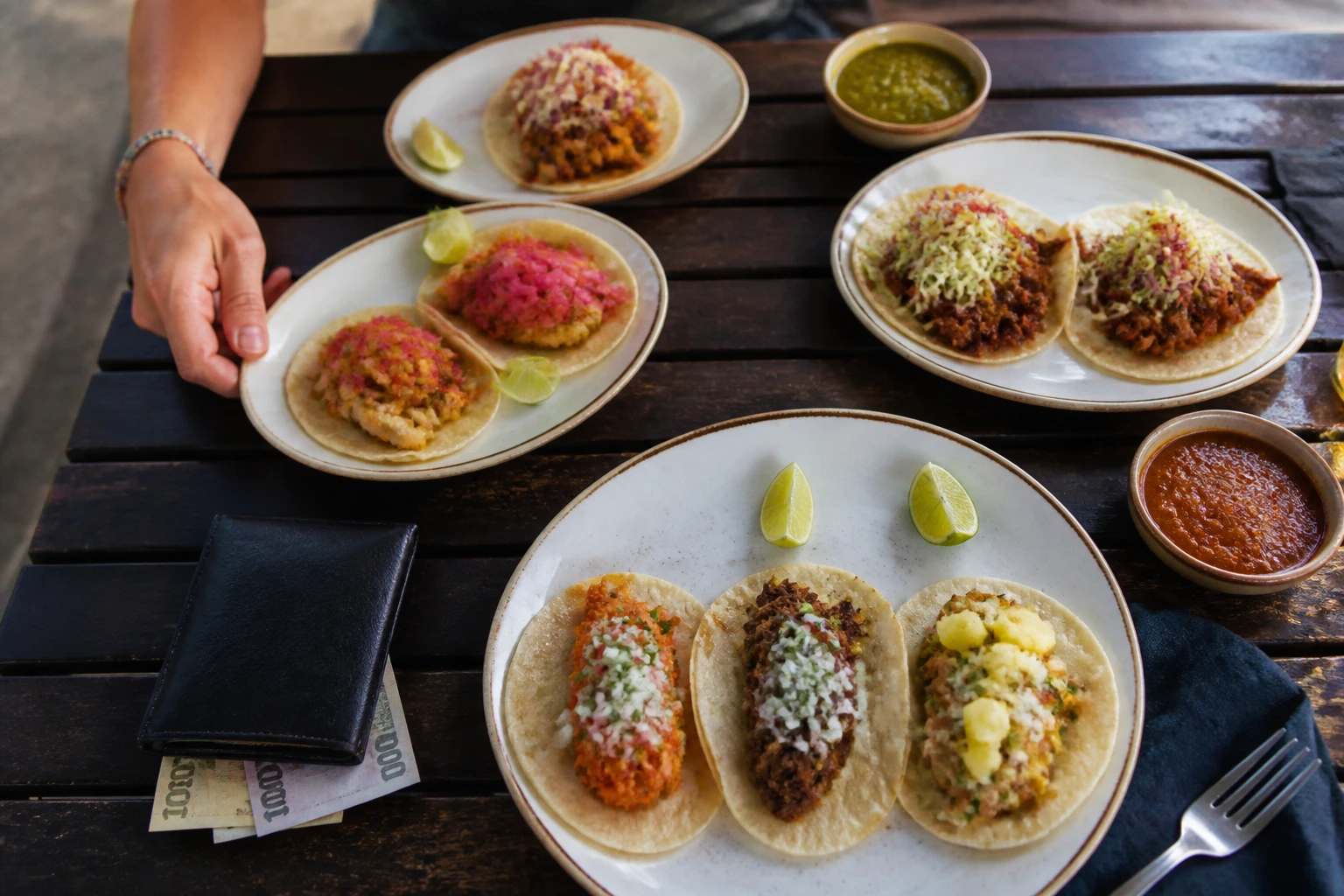 A small taco tasting with assorted fillings and cash for payment