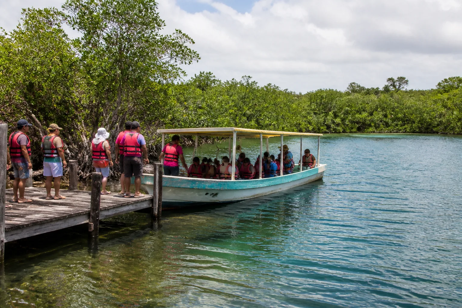 Passengers preparing for a lagoon boat outing near Muyil
