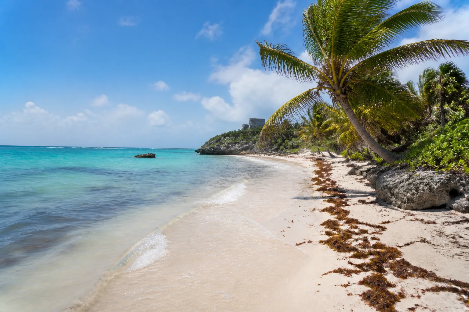 Caribbean shoreline in Tulum with changing beach conditions