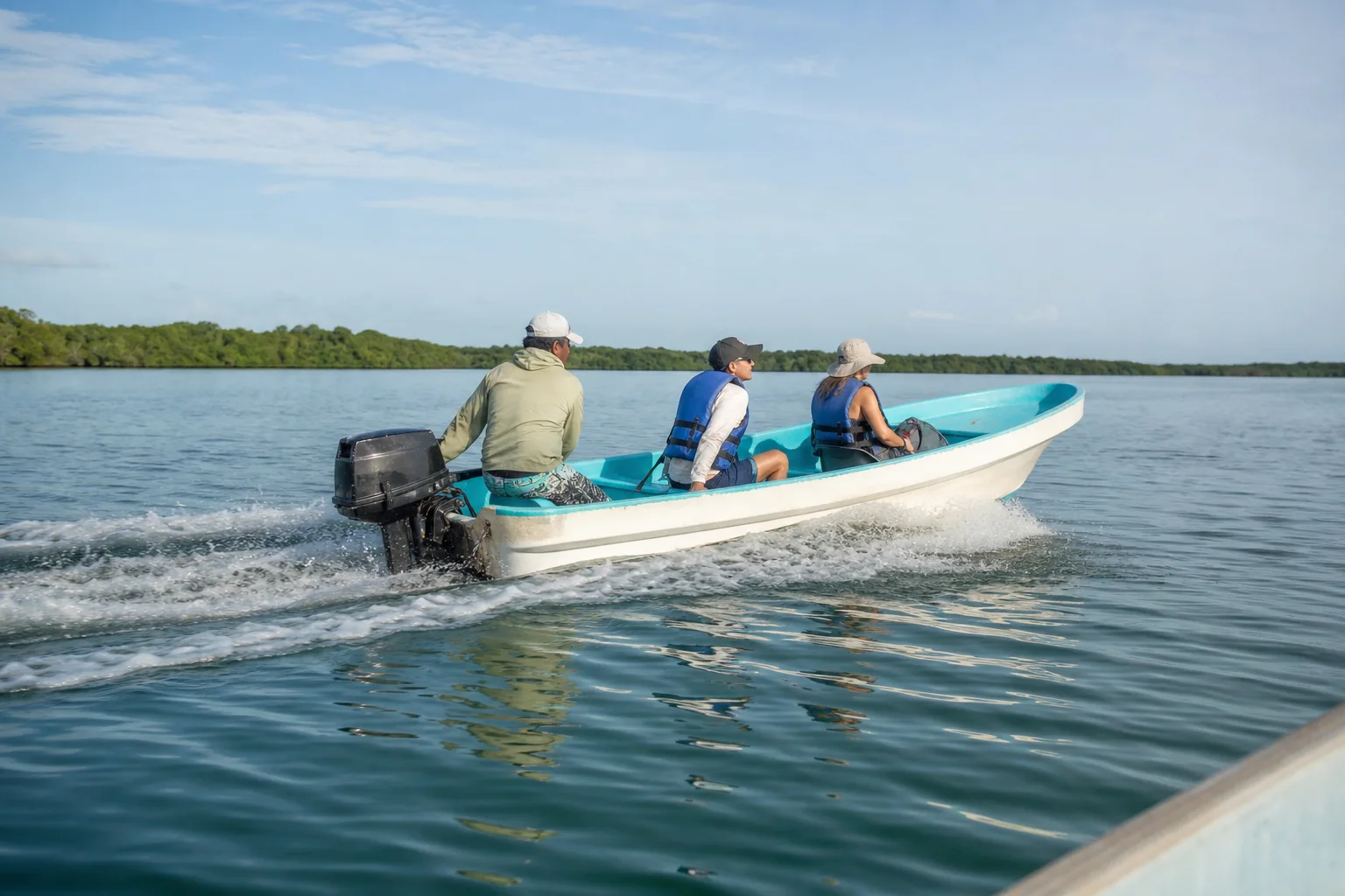 Small boat crossing Muyil Lagoon in Sian Kaan